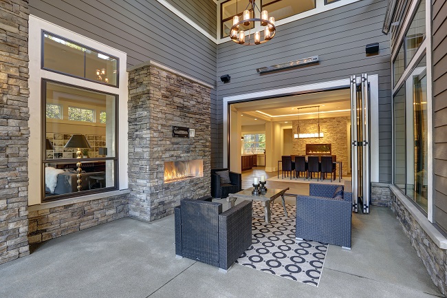 covered patio with fireplace