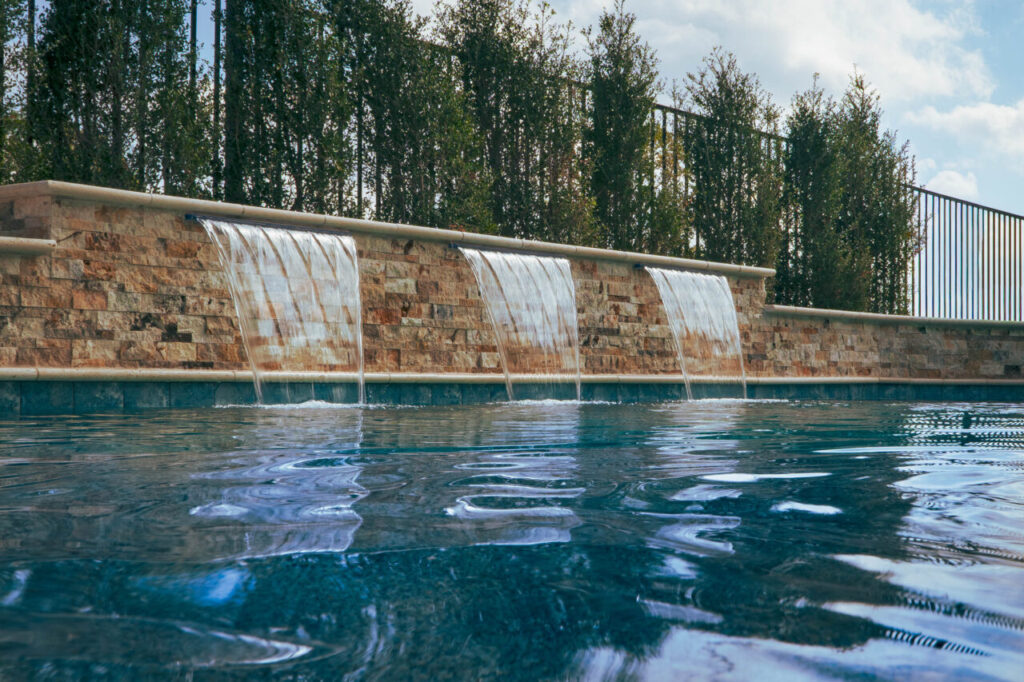 Luxury pool with Sheer Descent Water Features