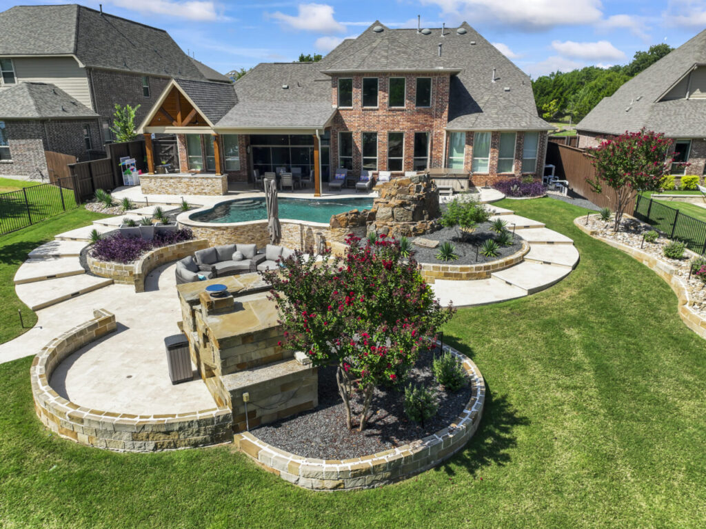 patio with custom pool, outdoor seating, and raised plant beds.