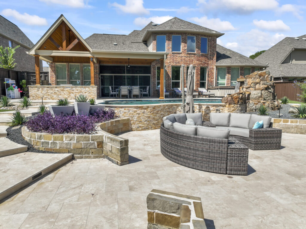 patio with custom pool, outdoor seating, and raised plant beds.