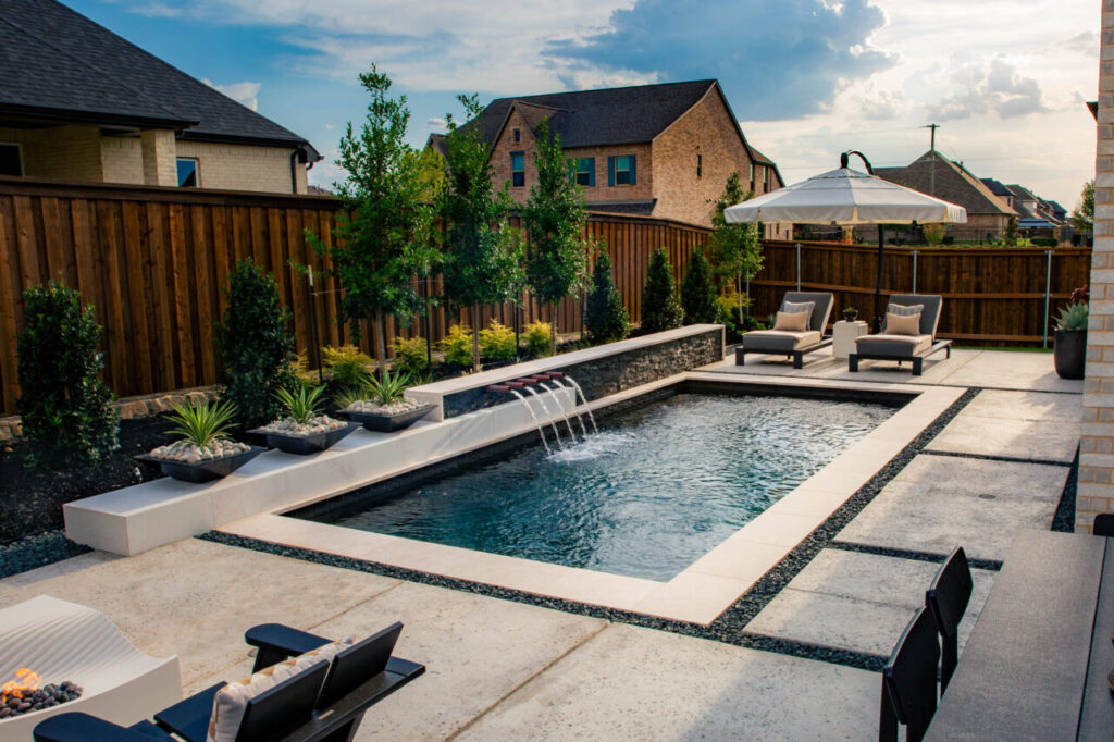 Custom geometric pool and landscaped backyard in North Texas